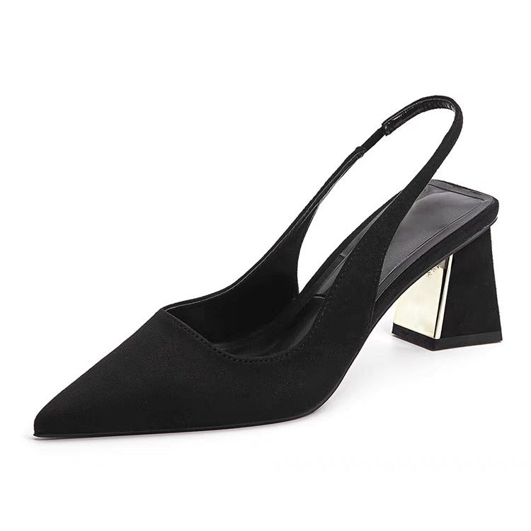 Black pointed-toe slingback pump with a block heel on a white background