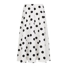 White skirt with black polka dots on a white background