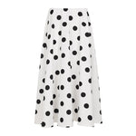 White skirt with black polka dots on a white background