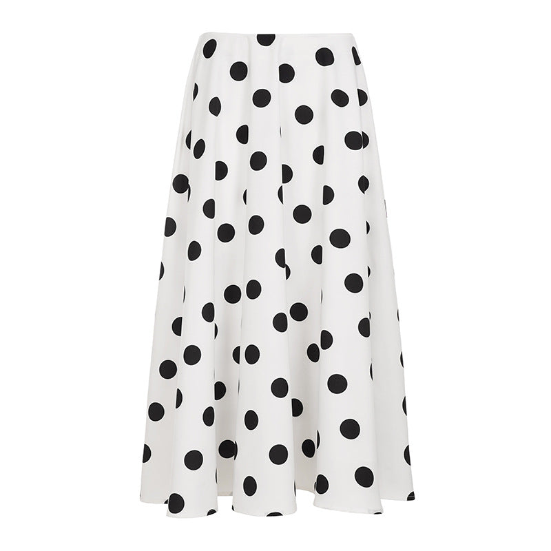 White skirt with black polka dots on a white background