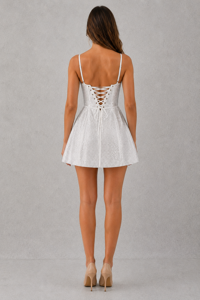 White lace-up dress worn by a model on a gray background