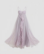 Lavender strapless gown with a flowing skirt on a light gray background