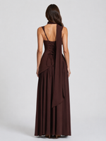 Brown evening gown with a draped design on a white background
