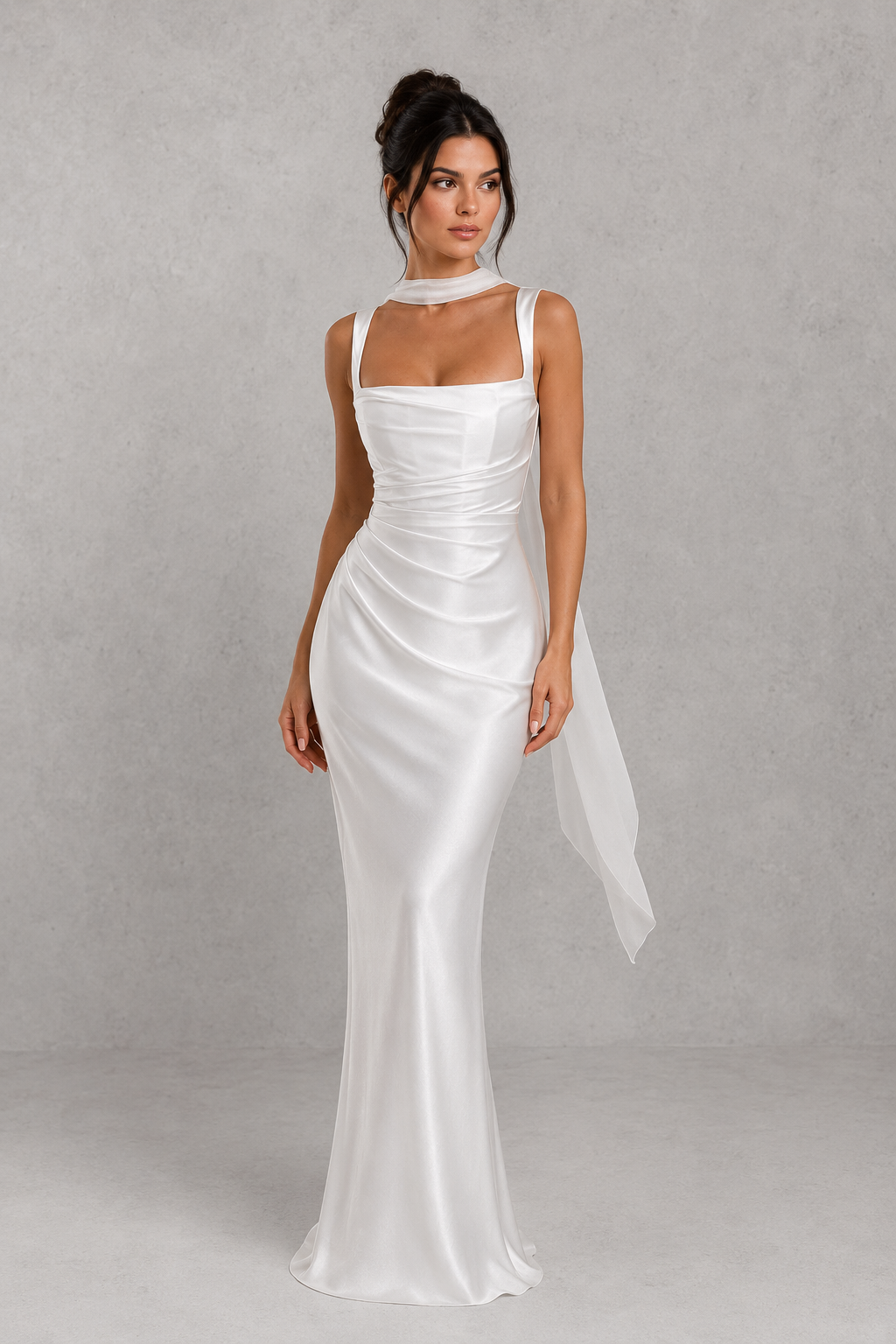 Woman wearing a white dress against a gray background
