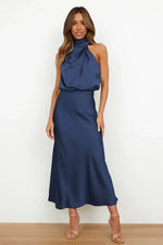 Woman wearing a blue dress against a white background