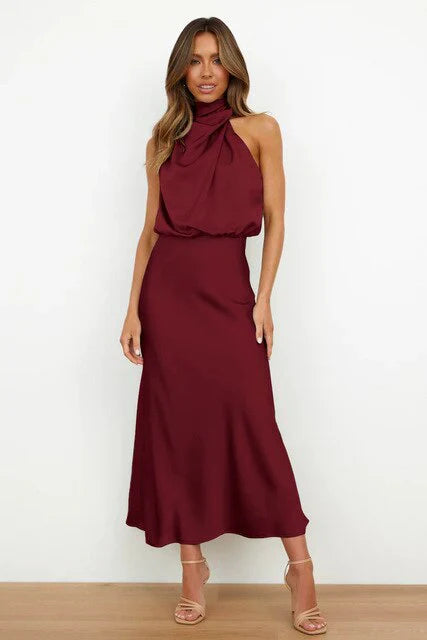 Woman wearing a burgundy dress against a white background