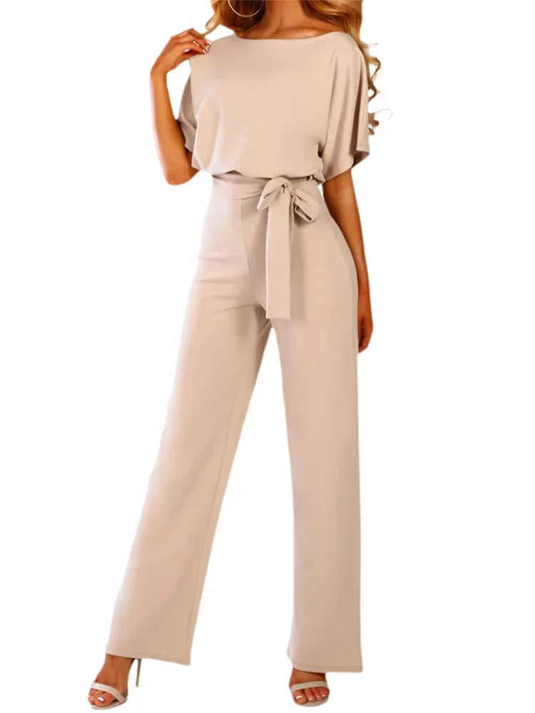 Beige jumpsuit worn by a model on a white background