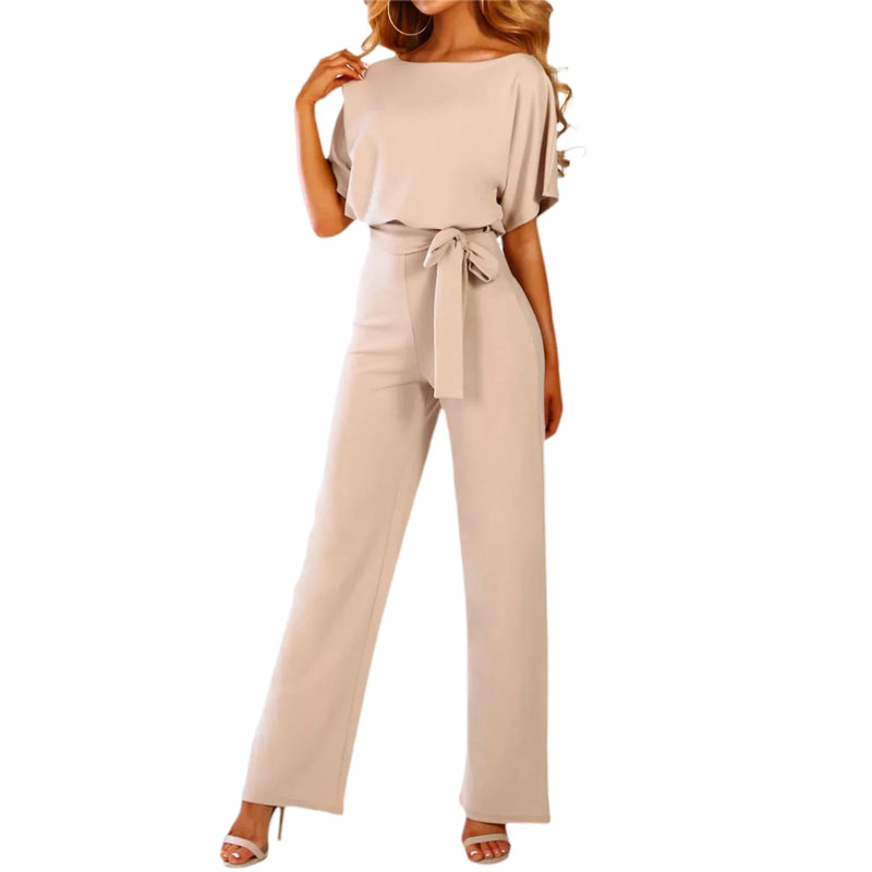 Beige jumpsuit worn by a model on a white background