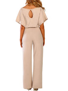 Beige jumpsuit with a cut-out back design on a white background