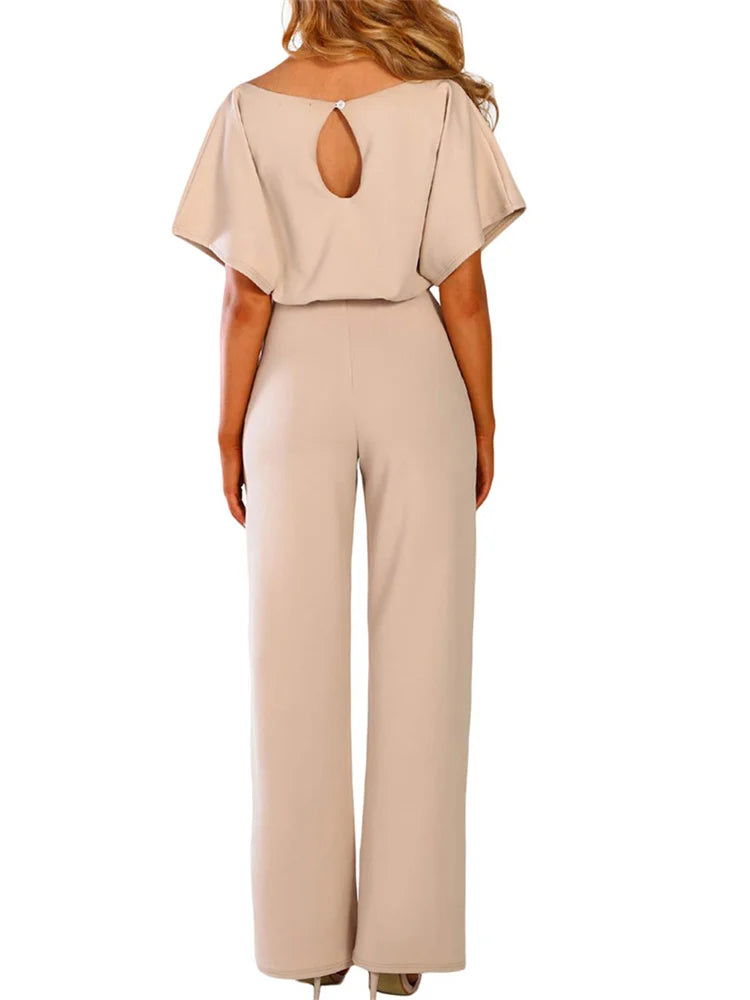 Beige jumpsuit with a cut-out back design on a white background