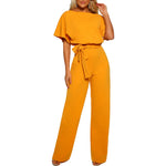 Yellow jumpsuit worn by a model on a white background