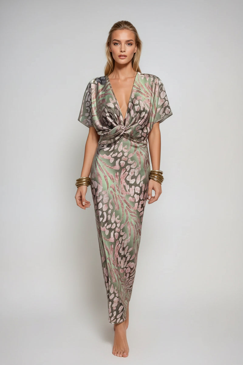 Woman wearing a floral dress with a plain background