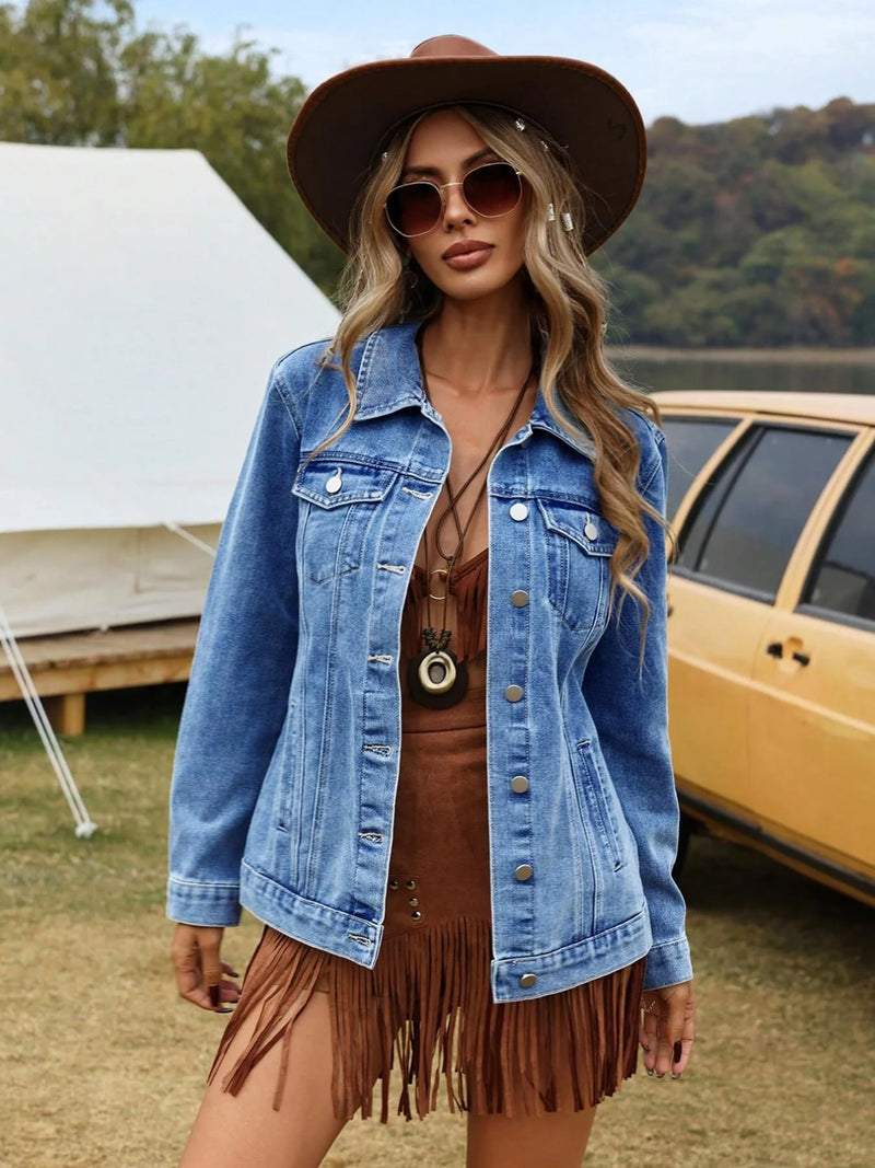 Woman wearing a denim jacket and brown hat outdoors with a tent and vehicle in the background
