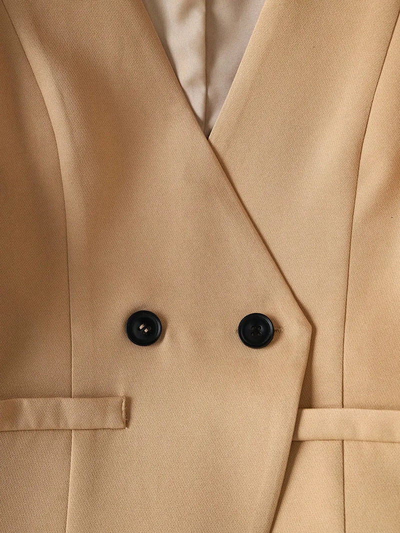 Close-up of a beige trench coat with black buttons