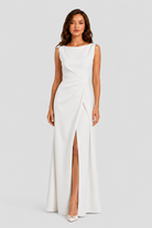 Women’s sleeveless maxi dress with boat neckline, draped waist detail, and wrap-style front panel