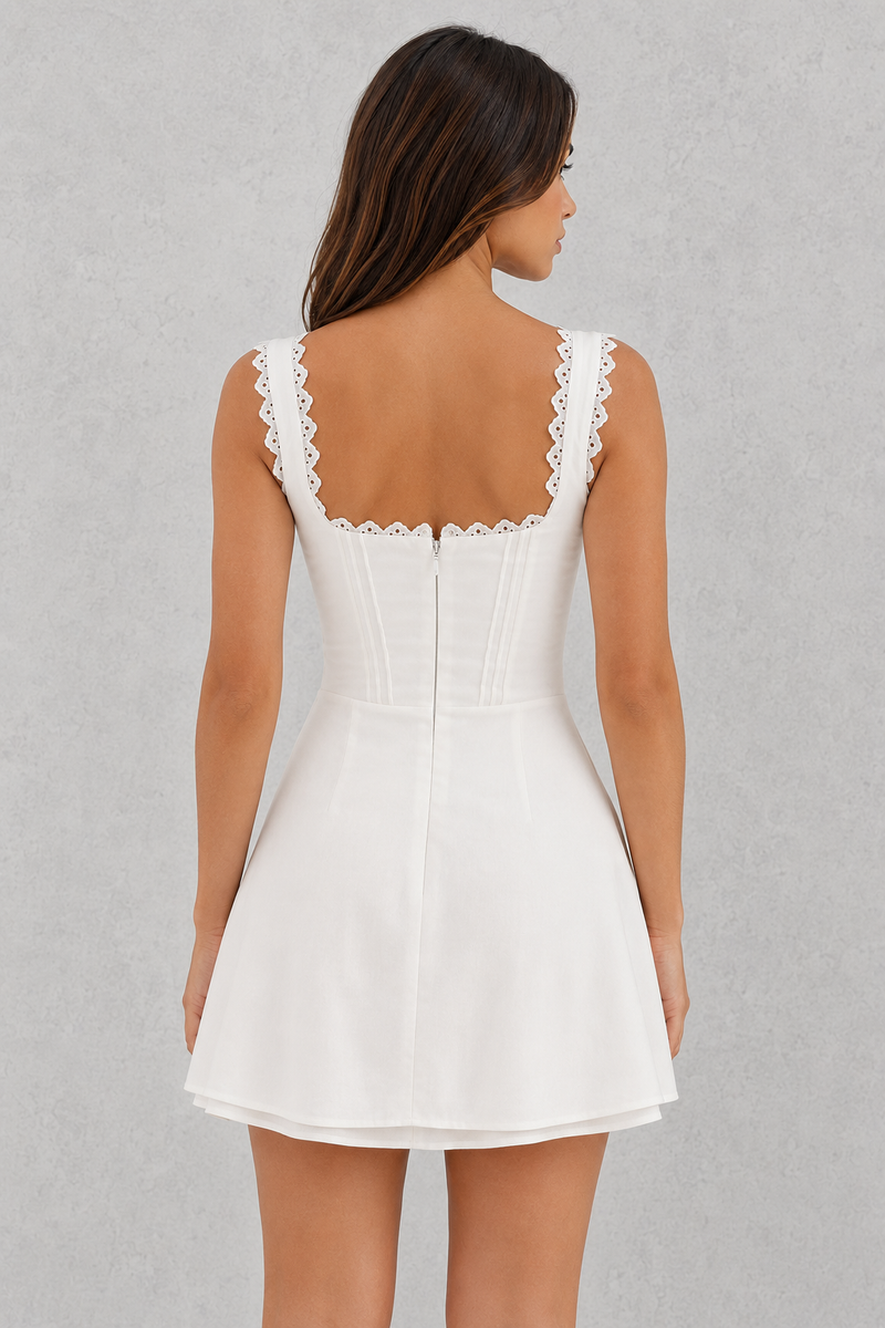 White dress with lace details on a gray background