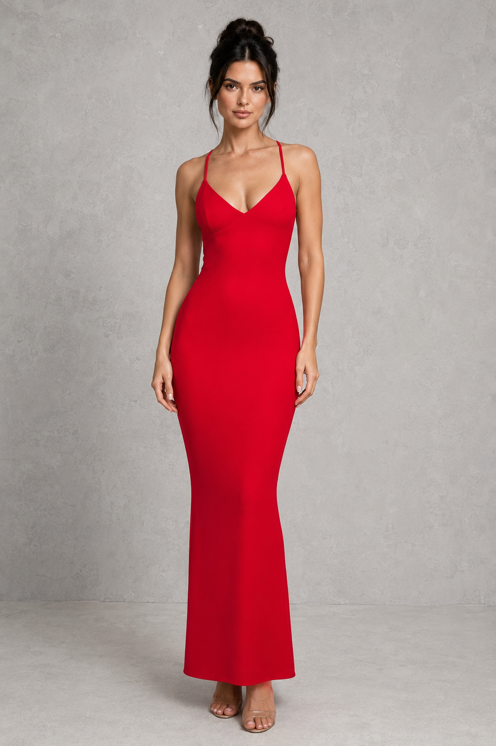 Woman wearing a red dress against a gray background