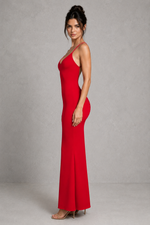 Woman wearing a red evening gown against a gray background