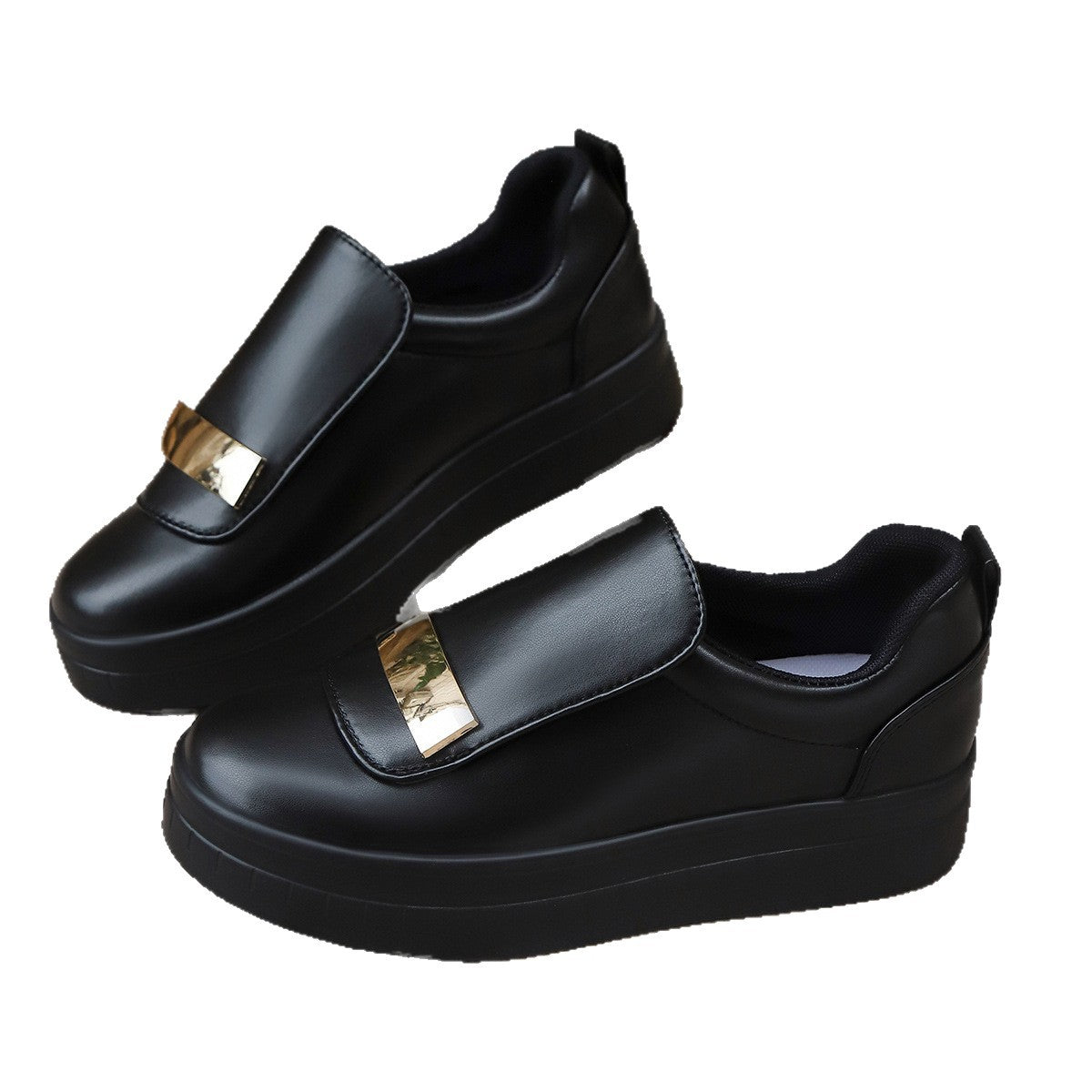 Black shoes with gold buckles on a white background