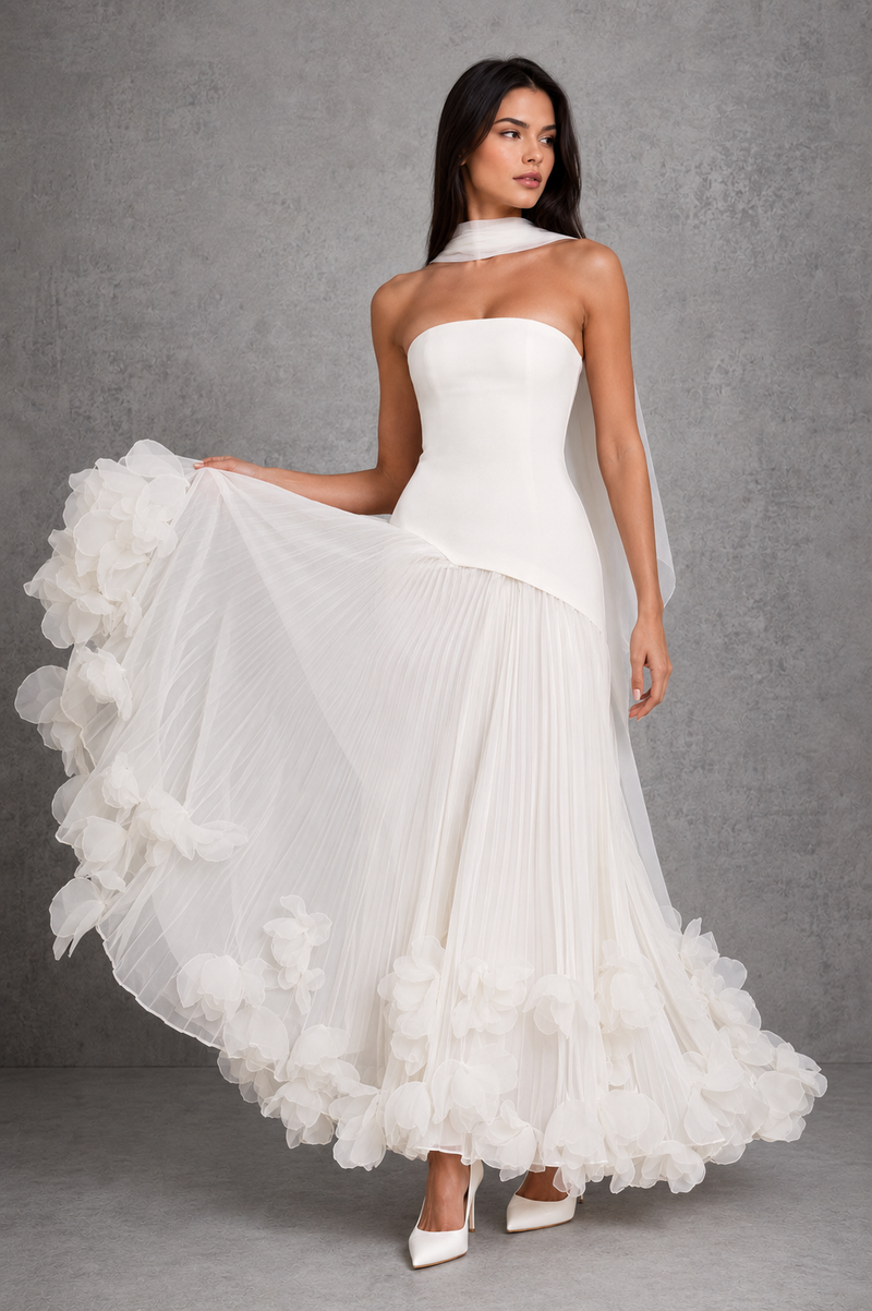 Women’s cherry lacquer strapless corset gown with a lace-up back, pleated full skirt, and handcrafted floral appliqué hem