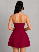 Red strapless dress worn by a person on a gray background