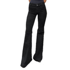 Black flared jeans on a white background