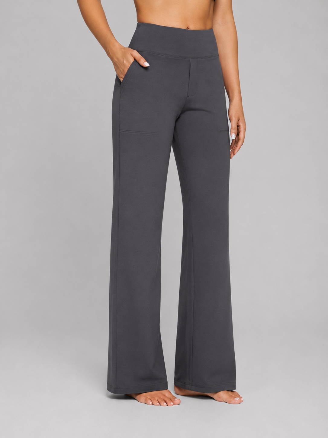 Dark gray wide-leg pants worn by a person on a gray background