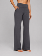 Dark gray wide-leg pants worn by a person on a gray background