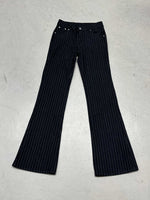 Black pinstripe pants on a light gray background