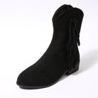 Black suede ankle boot with fringes on a white background