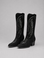 Black cowboy boots with detailed embroidery on a gray background