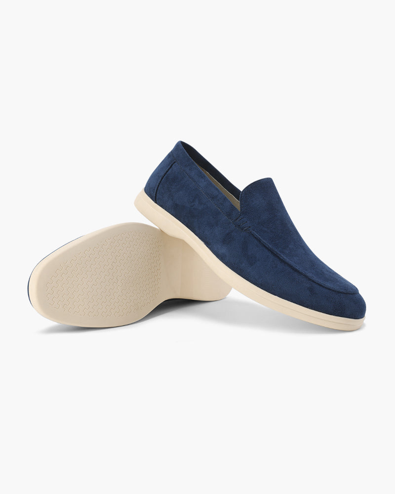 Blue suede loafer shoe on a white background