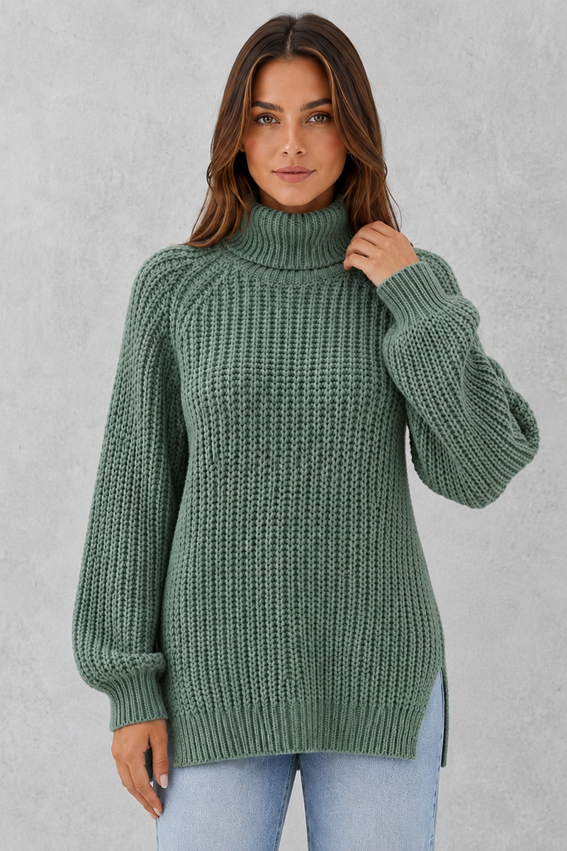 Woman wearing a green knitted sweater against a gray background