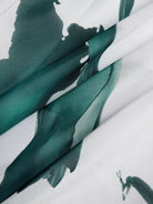 Close-up of green fabric with a white background